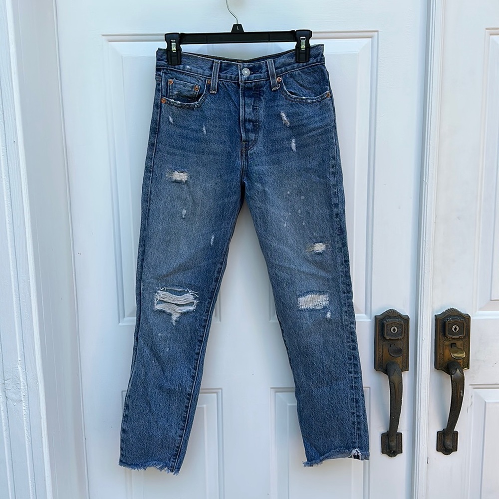 Distressed slim fit Levi’s jeans (not sure exact type)